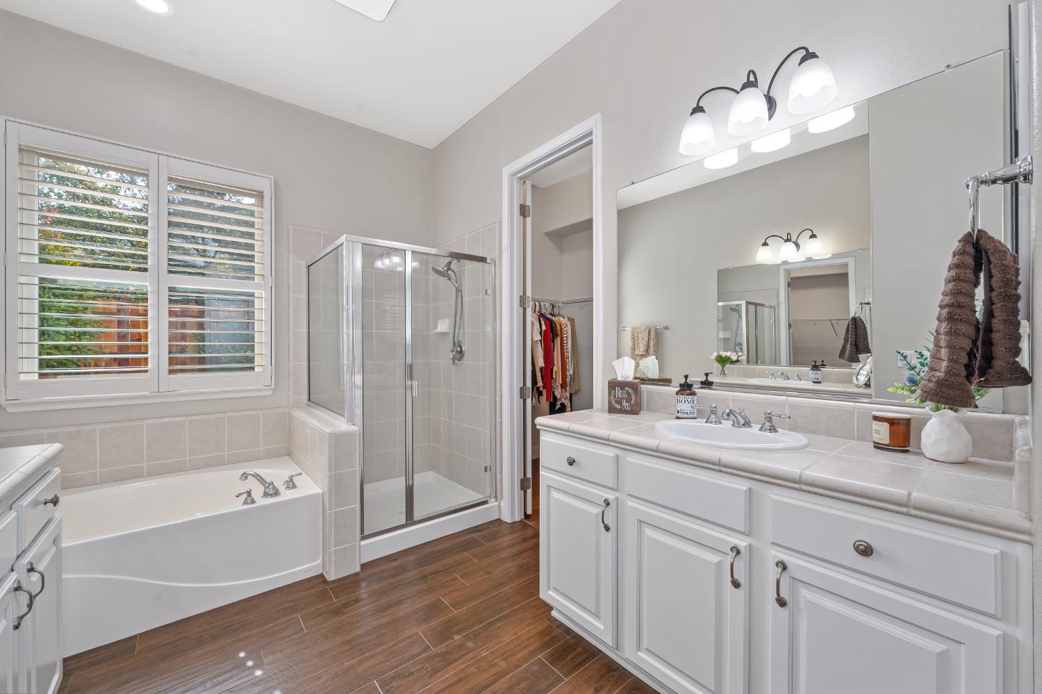 5966 Tanus Circle Rocklin, CA 95677 - Photo 6 of 38 a bathroom with a tub sink double vanity granite and shower