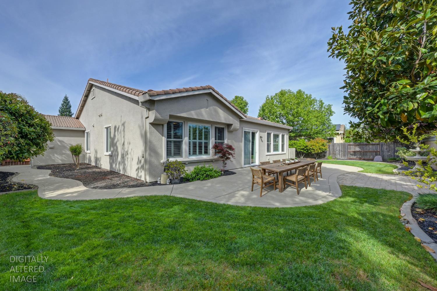 5966 Tanus Circle Rocklin, CA 95677 - Photo 7 of 38 a view of a house with a backyard and a patio
