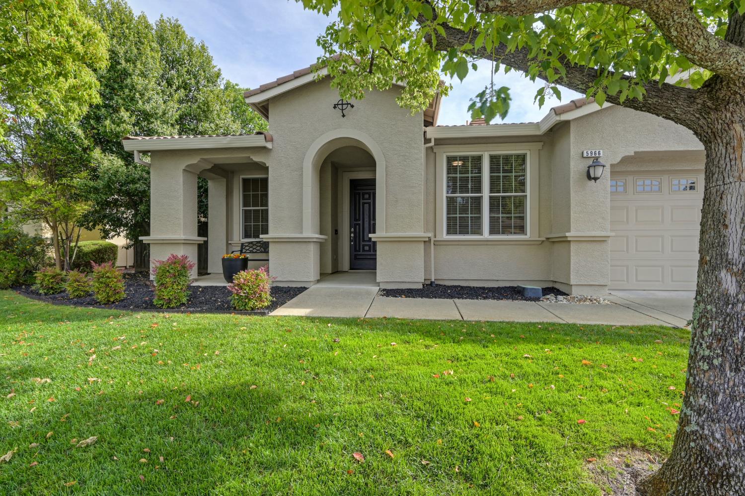 5966 Tanus Circle Rocklin, CA 95677 - Photo 9 of 38 a front view of a house with a yard and porch