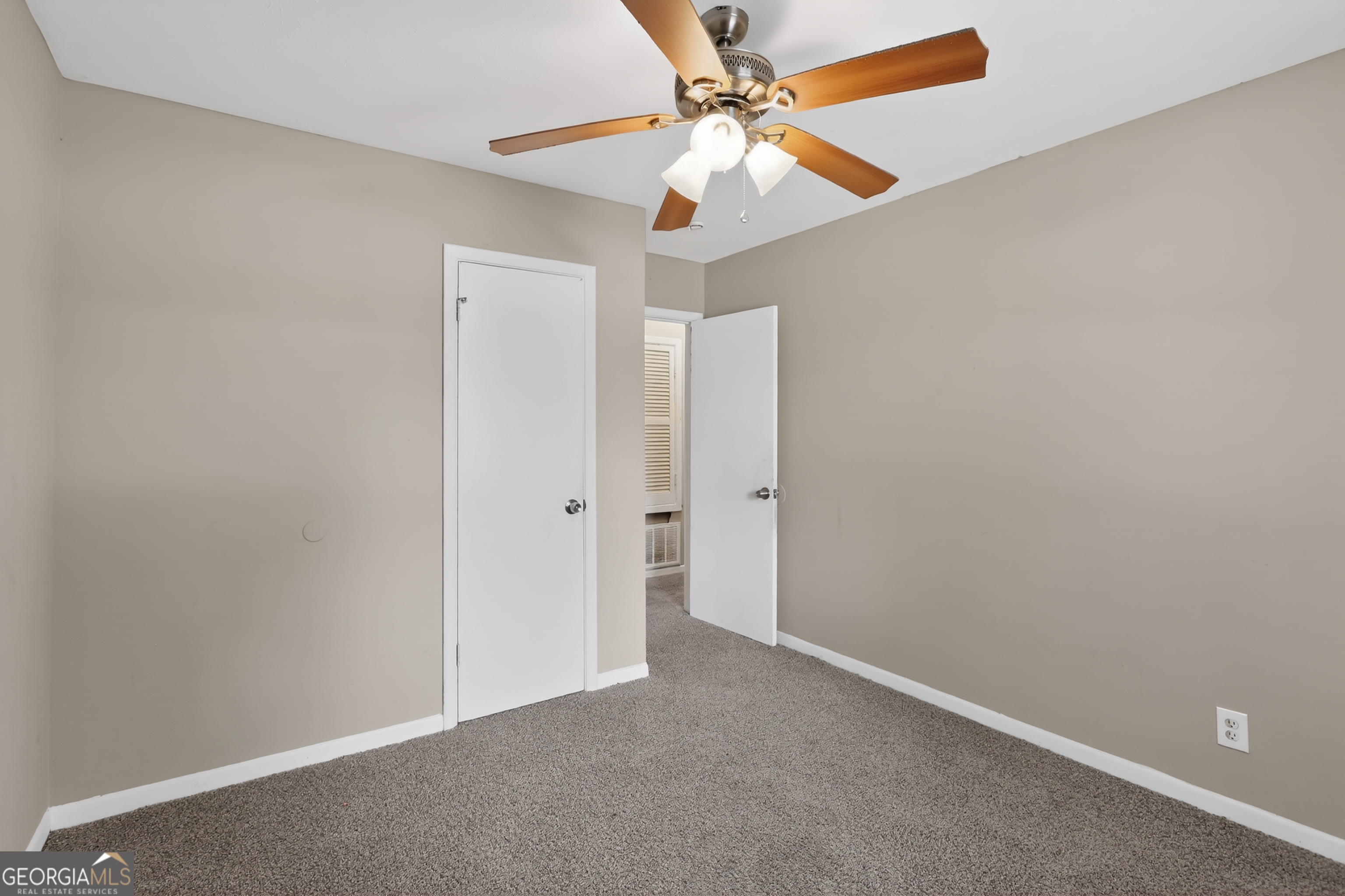 3606 Alene Circle Augusta, GA 30906 - Photo 19 of 30 an empty room with closet and a chandelier fan