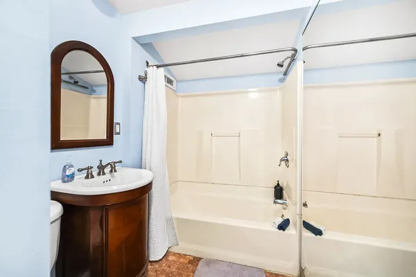a bathroom with a toilet and a sink