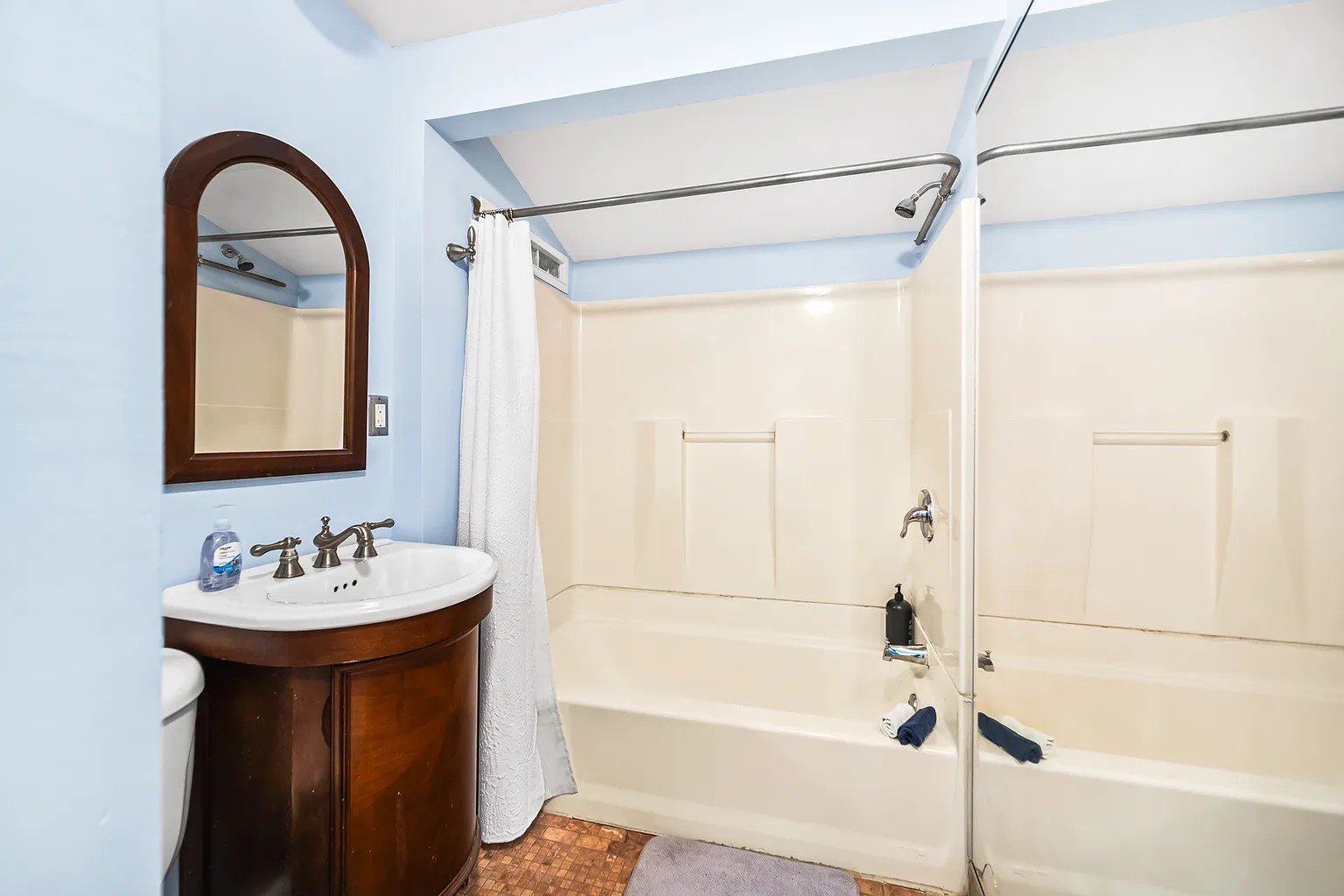 4812 Avenue G, Unit B Austin, TX 78751 - Photo 12 of 13 a bathroom with a sink and a mirror