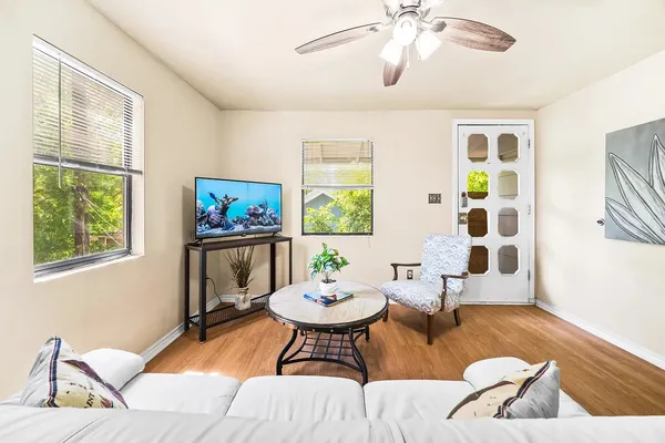 a living room with furniture and a large window