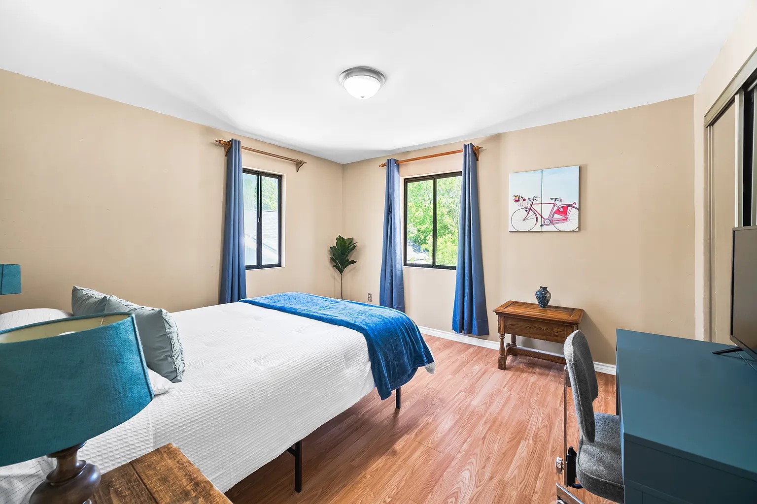 4812 Avenue G, Unit B Austin, TX 78751 - Photo 5 of 13 a bedroom with a bed and wooden floor