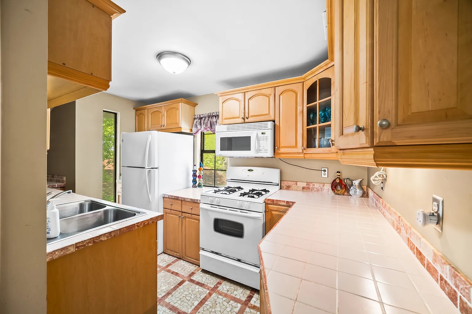4812 Avenue G, Unit B Austin, TX 78751 - Photo 8 of 13 a kitchen that has a sink and a stove top oven