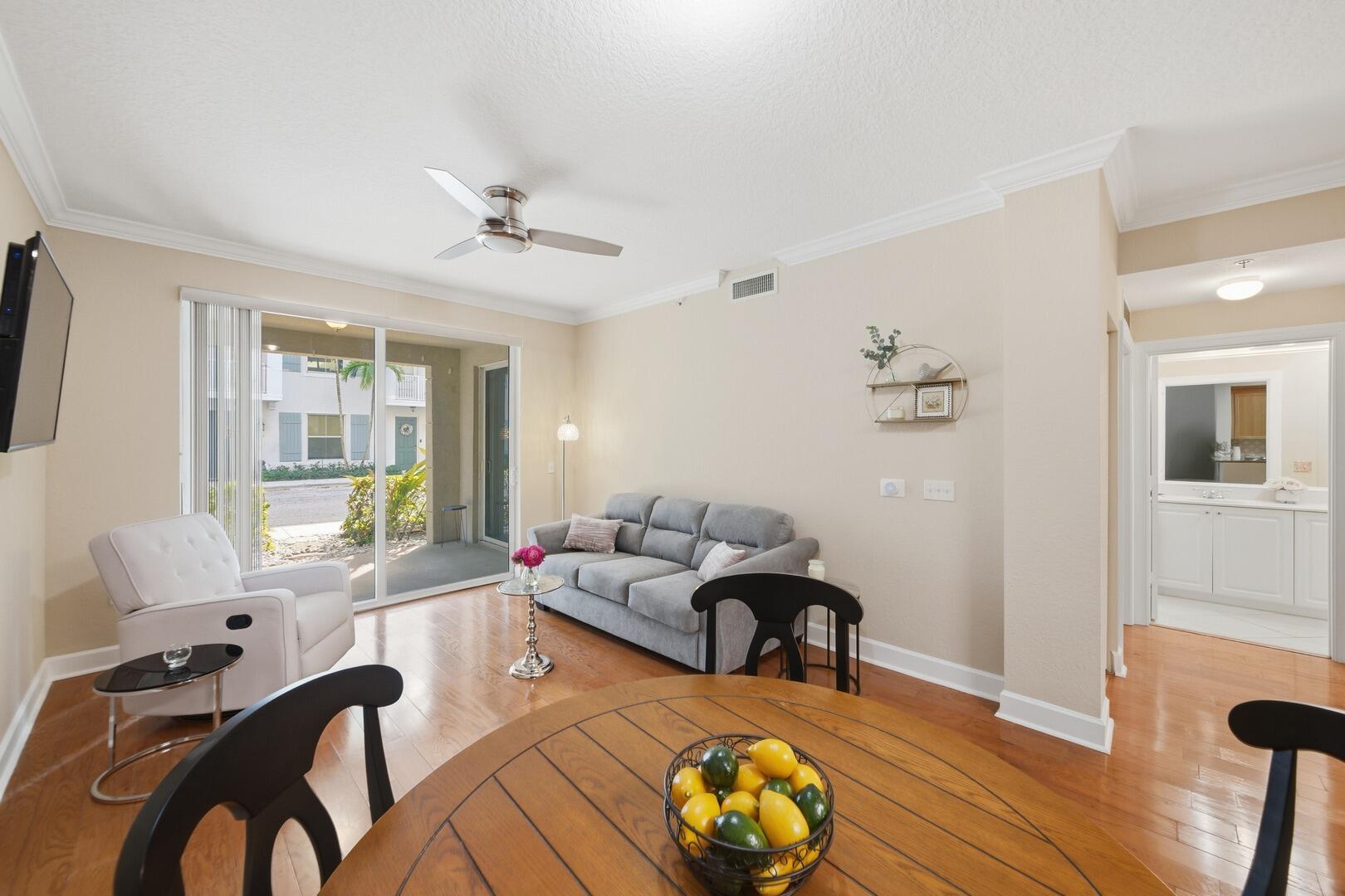 4 Renaissance Way, Unit 110 Boynton Beach, FL 33426 - Photo 15 of 26 a living room with furniture and wooden floor