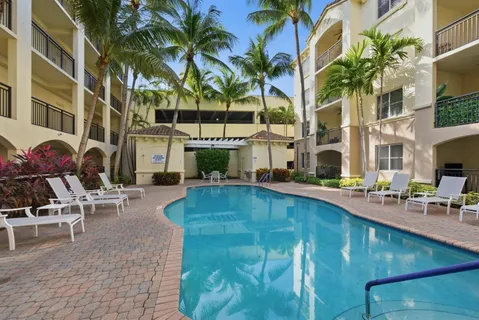 a view of a swimming pool with chairs