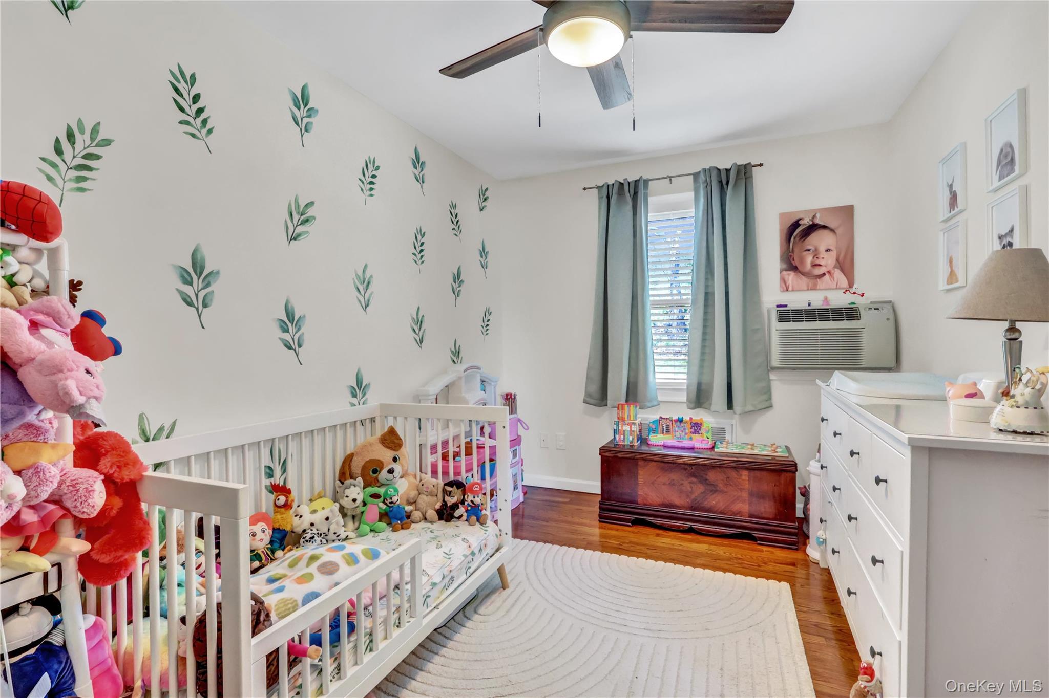 251-21 71st Road, Unit 44A Queens, NY 11426 - Photo 15 of 25 a bedroom with furniture and a couch