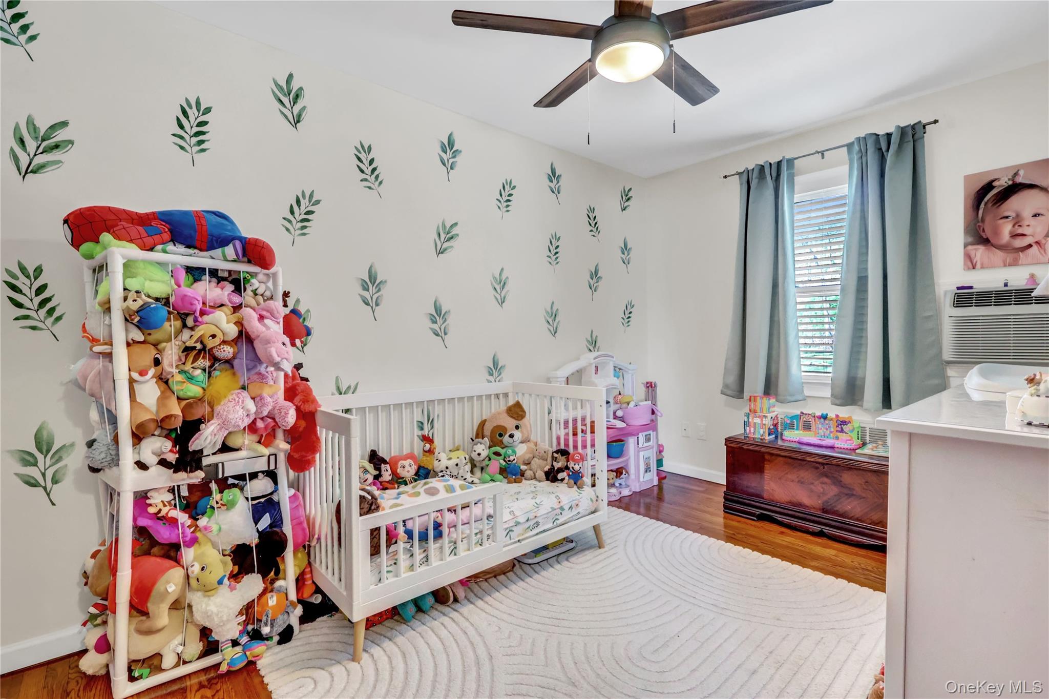 251-21 71st Road, Unit 44A Queens, NY 11426 - Photo 16 of 25 a bedroom that has a bed and a window