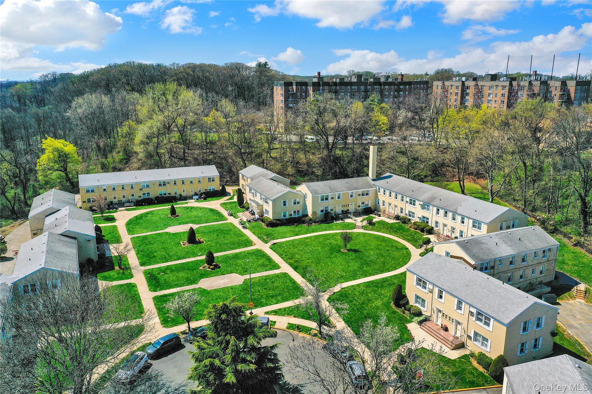 251-21 71st Road, Unit 44A Queens, NY 11426 - Photo 19 of 25 a view of a swimming pool with a patio