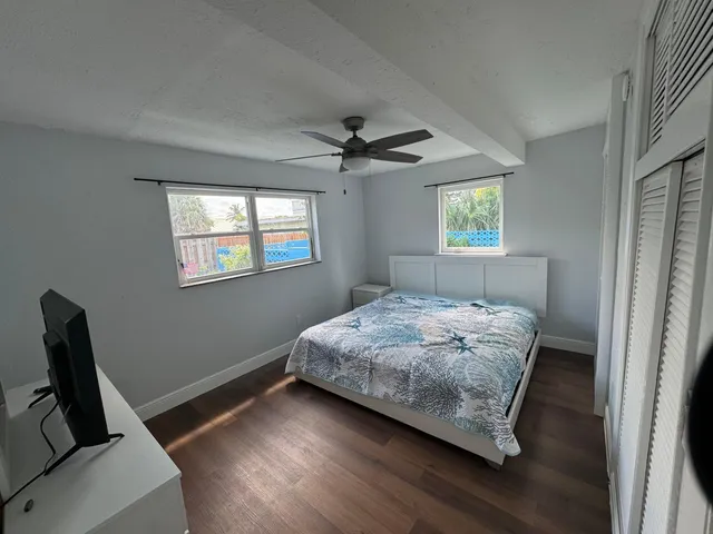 a bedroom with bed and window