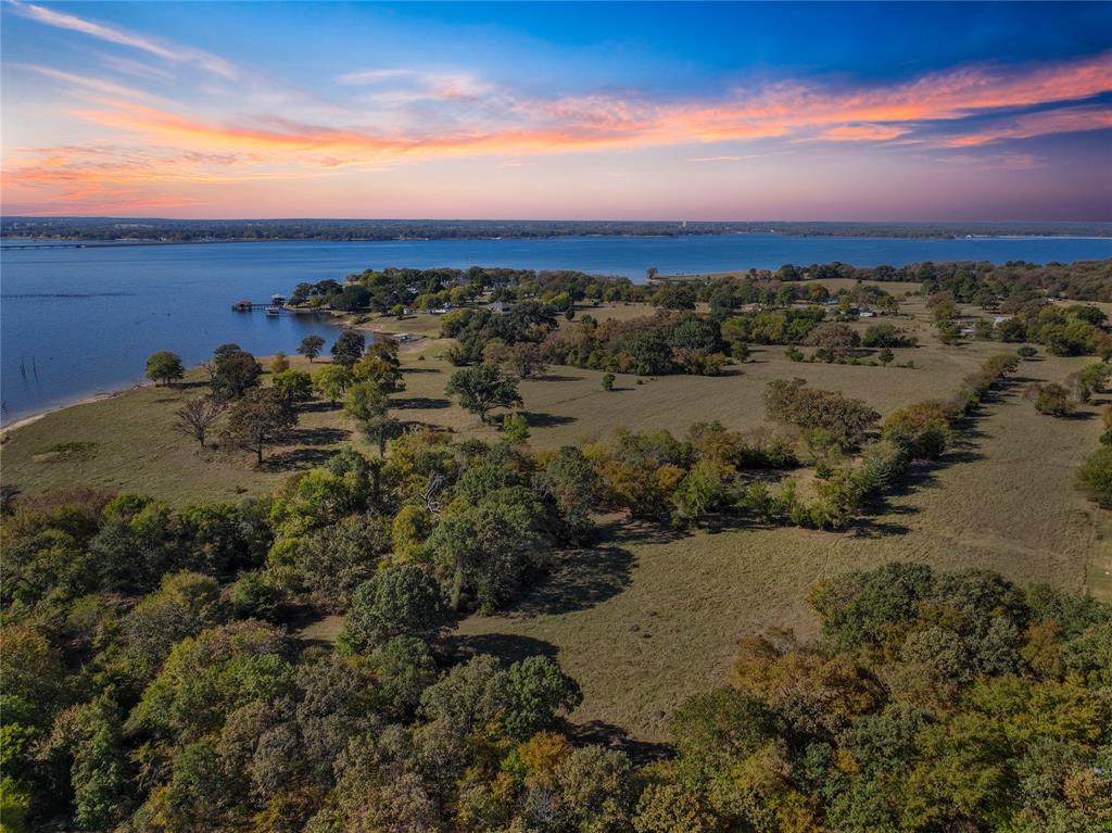 514 Spur 514 Yantis, TX 75497 - Photo 12 of 12 a view of sunset view with beach and ocean view