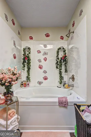 a bathroom with a bathtub and a shower curtain