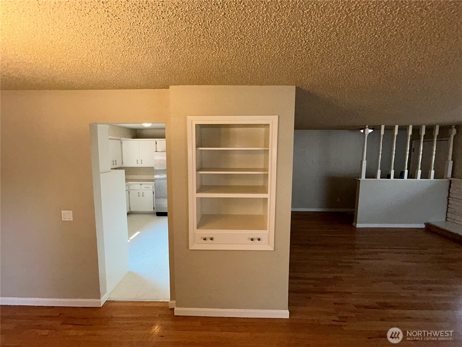 6605 South 127th Place Seattle, WA 98178 - Photo 11 of 38 a view of walk in closet with empty racks