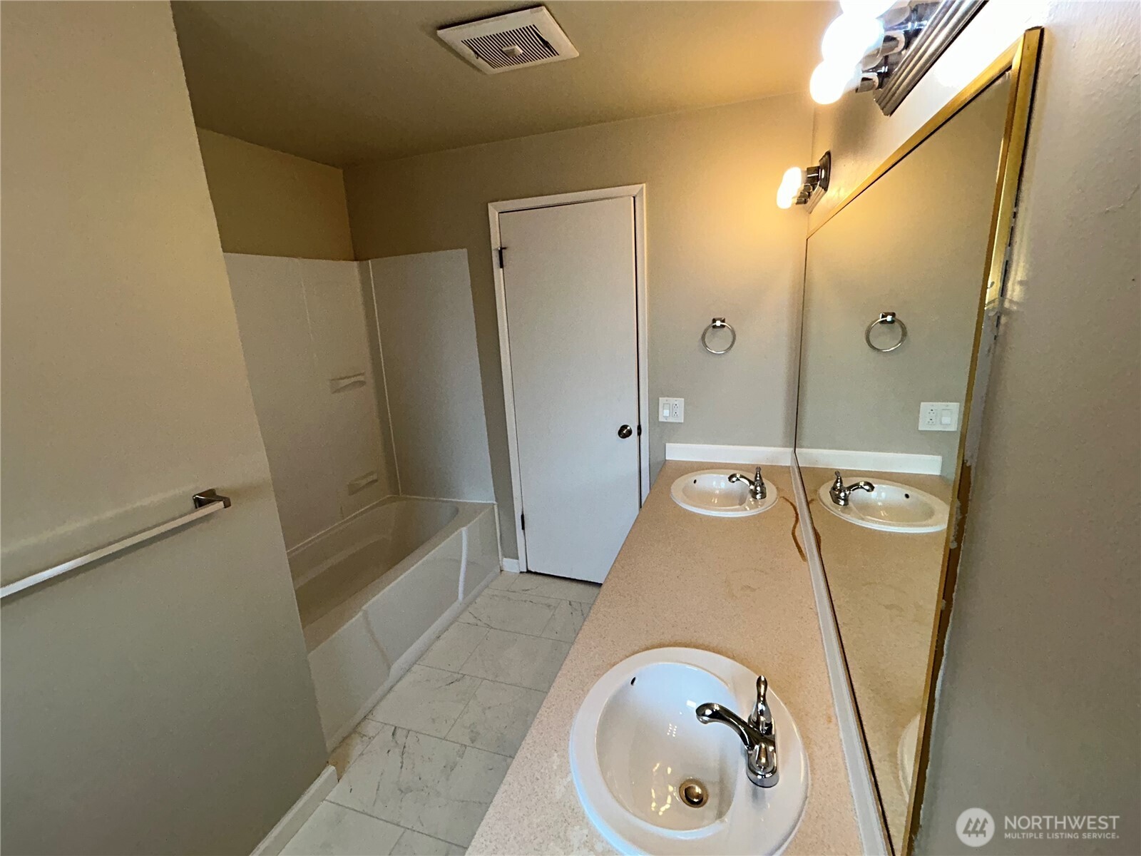 6605 South 127th Place Seattle, WA 98178 - Photo 17 of 38 a bathroom with a tub a sink and glass door shower