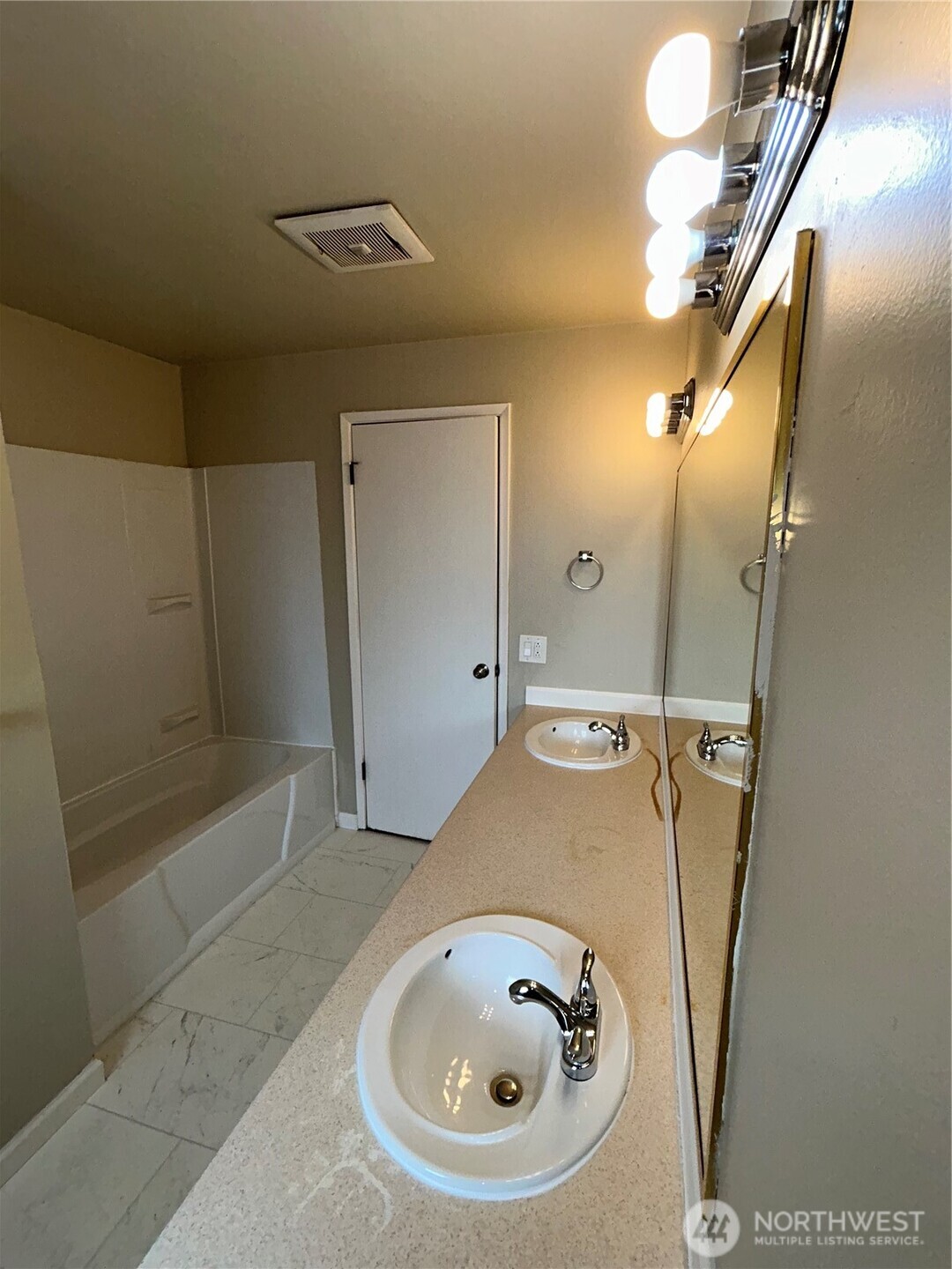6605 South 127th Place Seattle, WA 98178 - Photo 18 of 38 a bathroom with a sink and shower