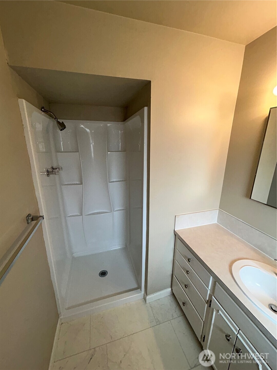 6605 South 127th Place Seattle, WA 98178 - Photo 24 of 38 a bathroom with a granite countertop sink and a mirror