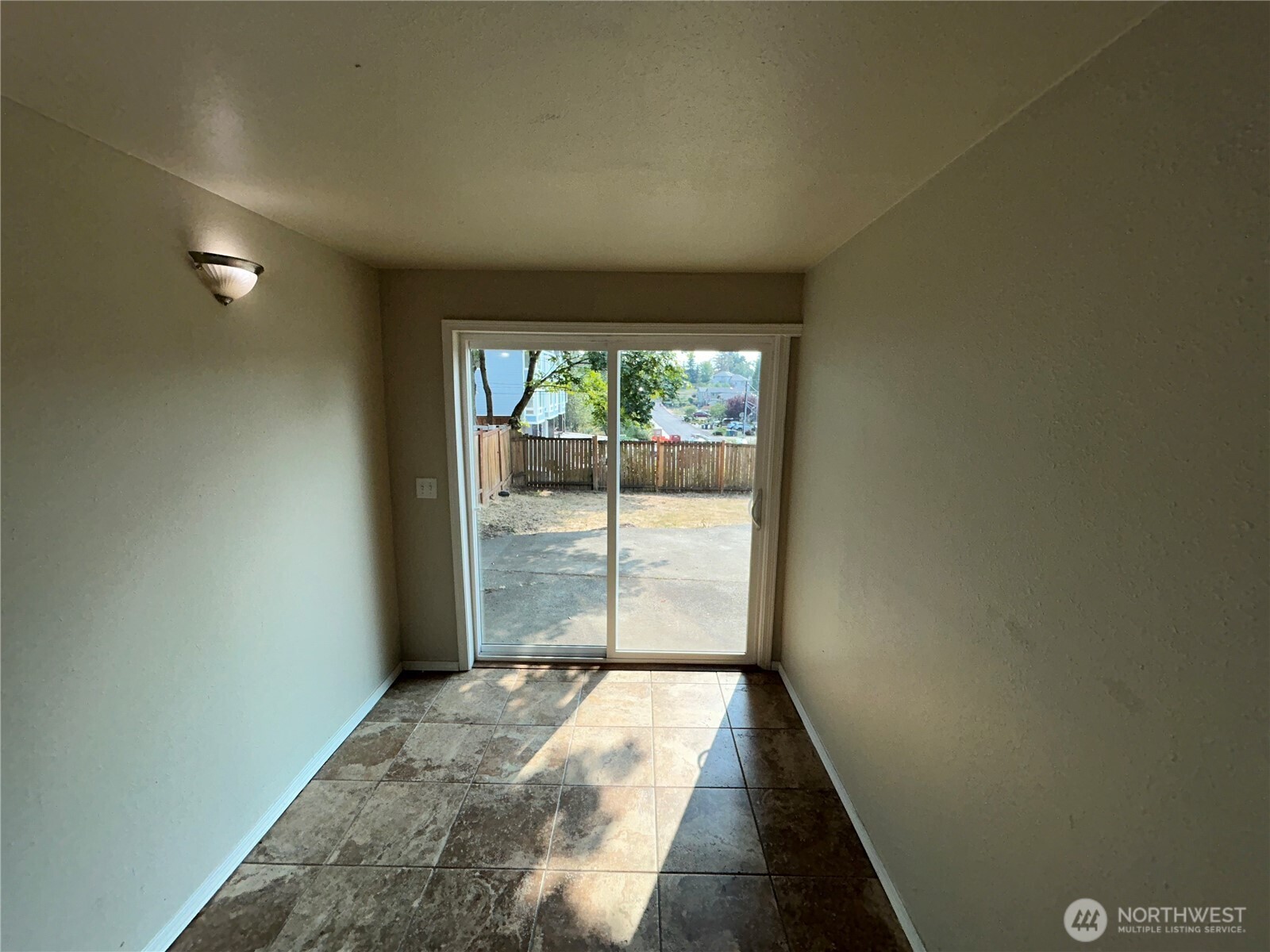 6605 South 127th Place Seattle, WA 98178 - Photo 25 of 38 a view of empty room with wooden floor and fan
