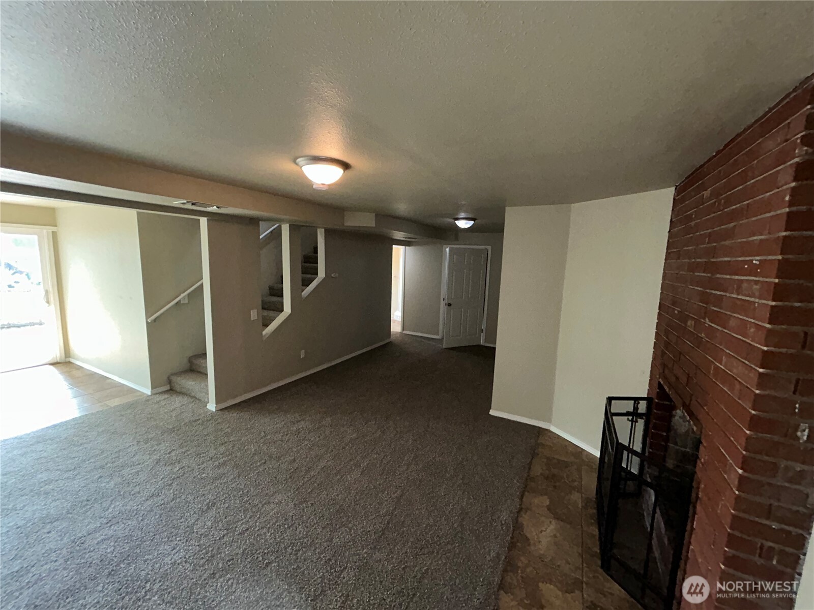 6605 South 127th Place Seattle, WA 98178 - Photo 27 of 38 a view of hallway with stairs