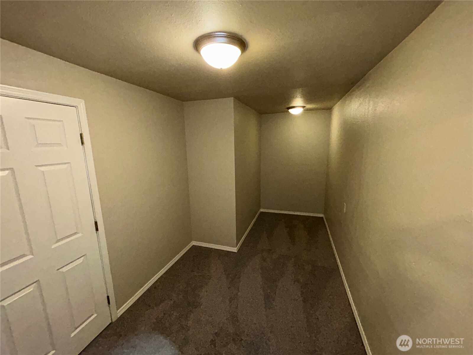 6605 South 127th Place Seattle, WA 98178 - Photo 31 of 38 en empty room with wooden floor