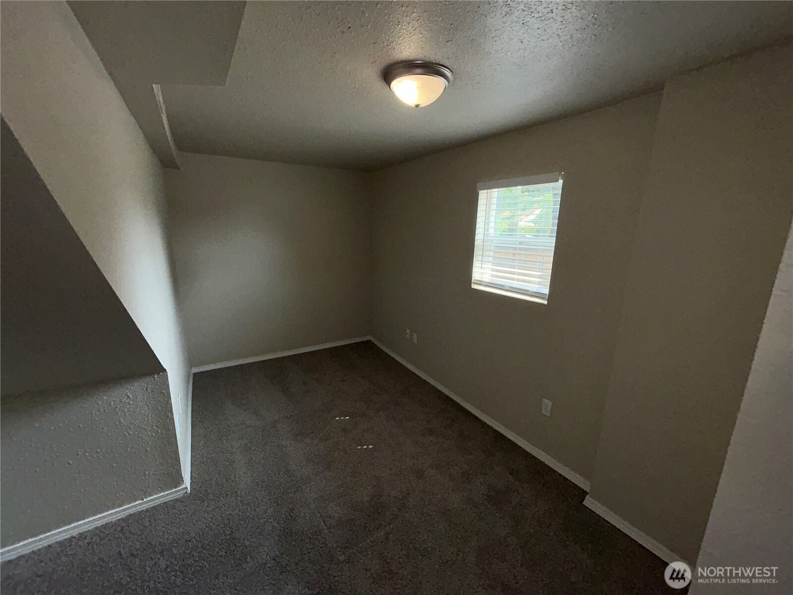 6605 South 127th Place Seattle, WA 98178 - Photo 32 of 38 an empty room with a empty space and windows