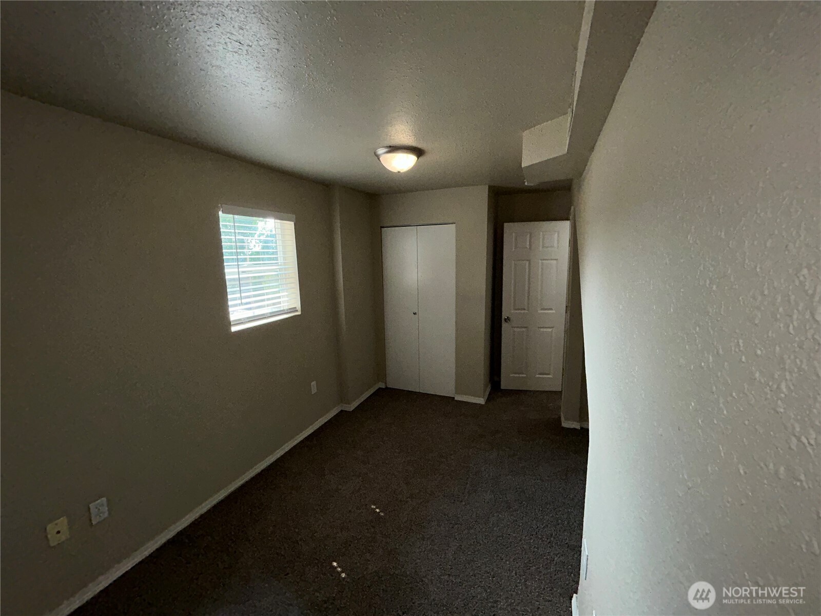 6605 South 127th Place Seattle, WA 98178 - Photo 33 of 38 an empty room with windows