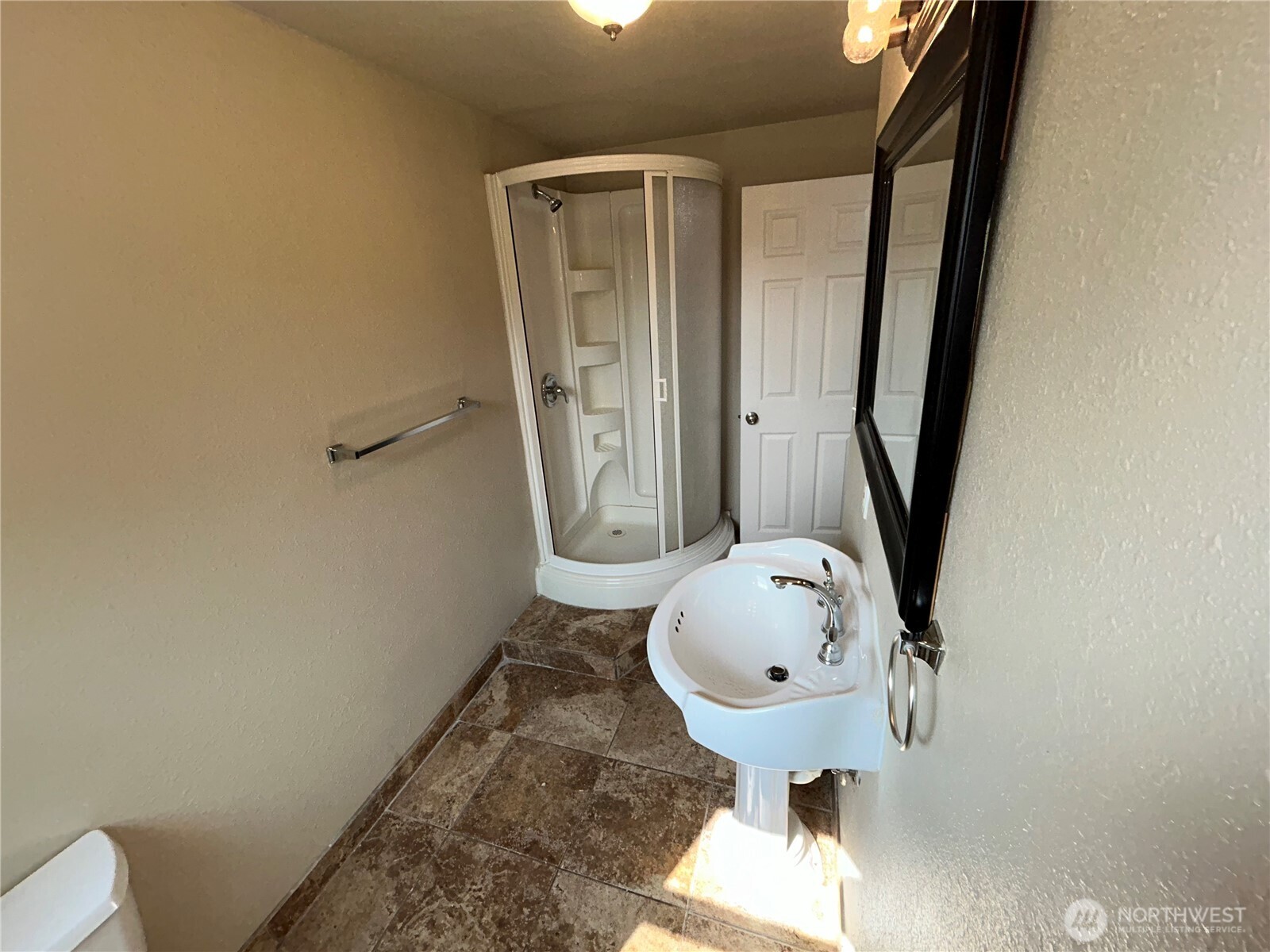 6605 South 127th Place Seattle, WA 98178 - Photo 34 of 38 a bathroom with a sink and mirror