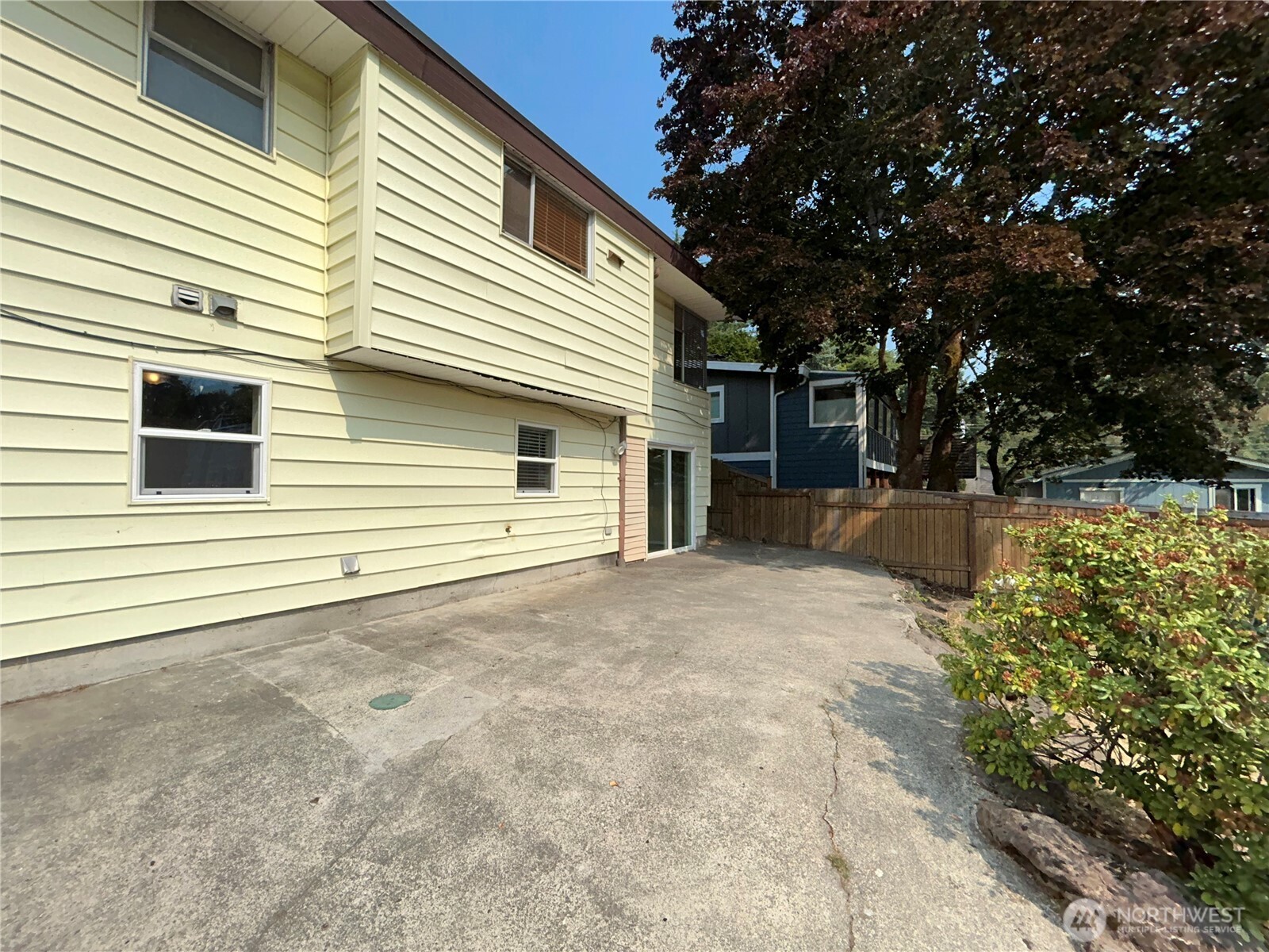6605 South 127th Place Seattle, WA 98178 - Photo 35 of 38 a view of a house with a backyard