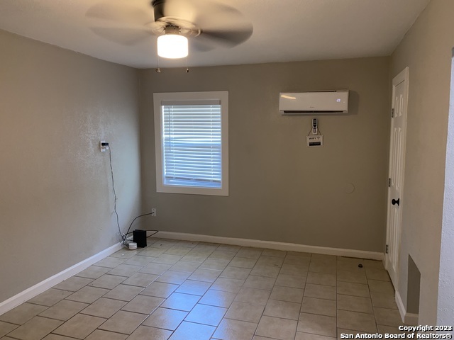 115 Caldwell Street, Unit 3 San Antonio, TX 78223 - Photo 2 of 5 a view of an empty room with a window