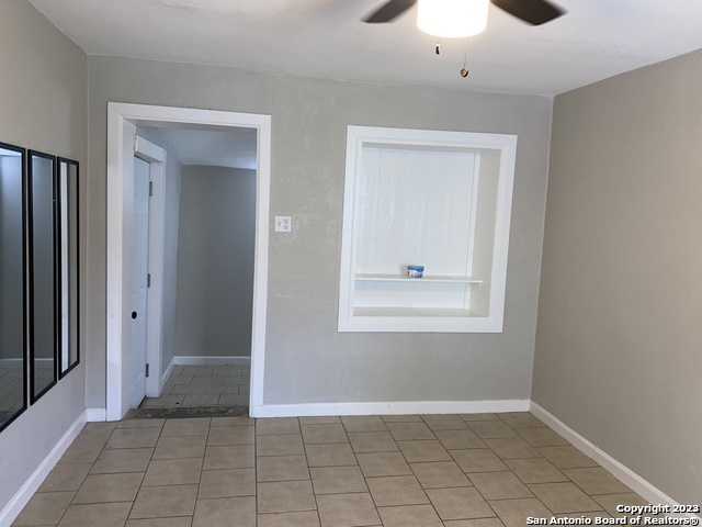 115 Caldwell Street, Unit 3 San Antonio, TX 78223 - Photo 3 of 5 an empty room with closet and a chandelier fan