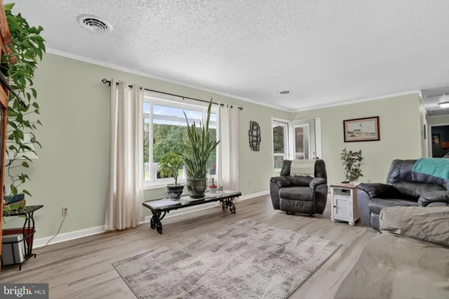a bedroom with a bed and flat screen tv