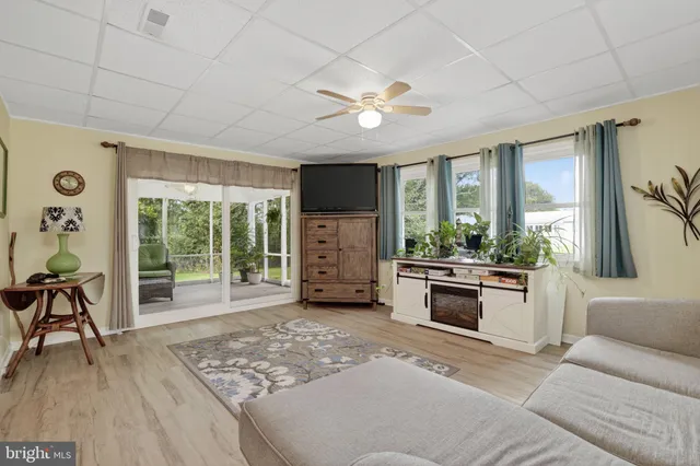 a bedroom with a bed a table and a window