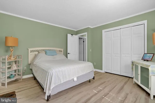 a room with a bed and a flat screen tv