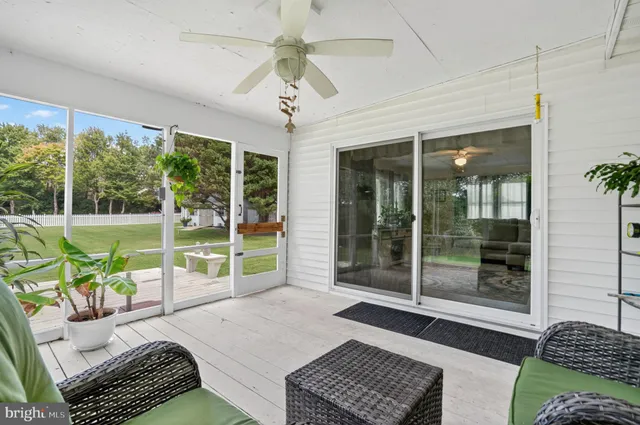 a view of a deck with a yard