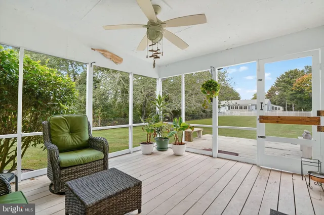 a view of yard with swimming pool and green space