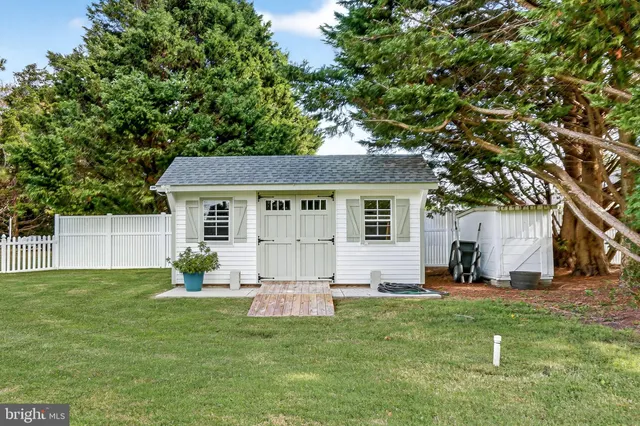 an aerial view of a houses with a yard