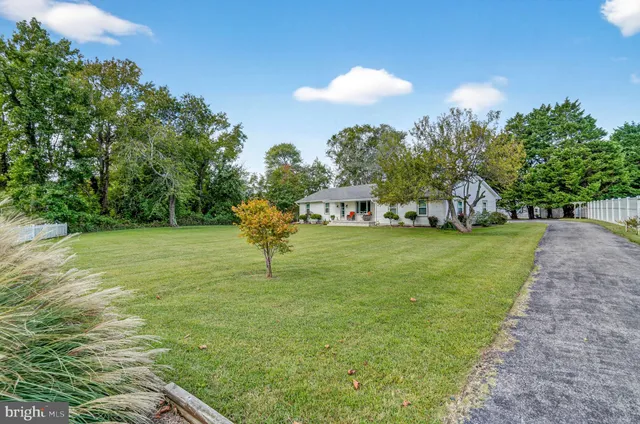 a view of a house with outdoor seating