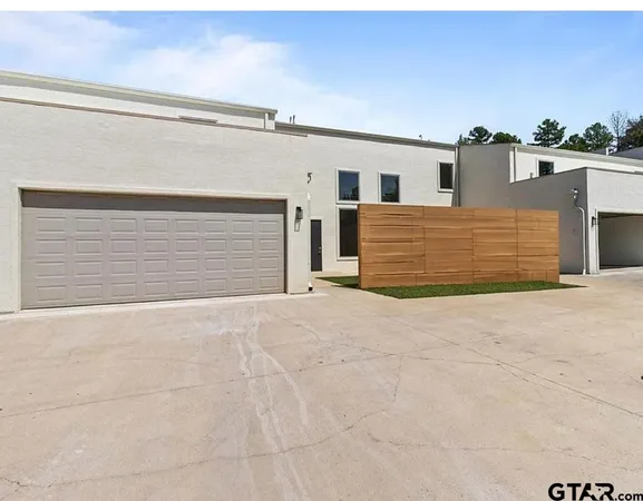 a front view of a house with a garage