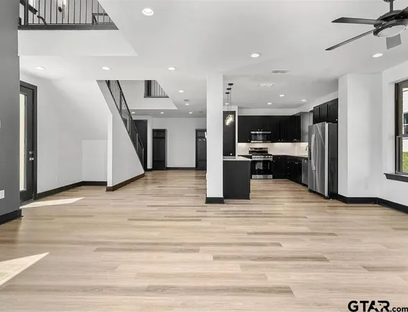 a view of kitchen and kitchen with furniture