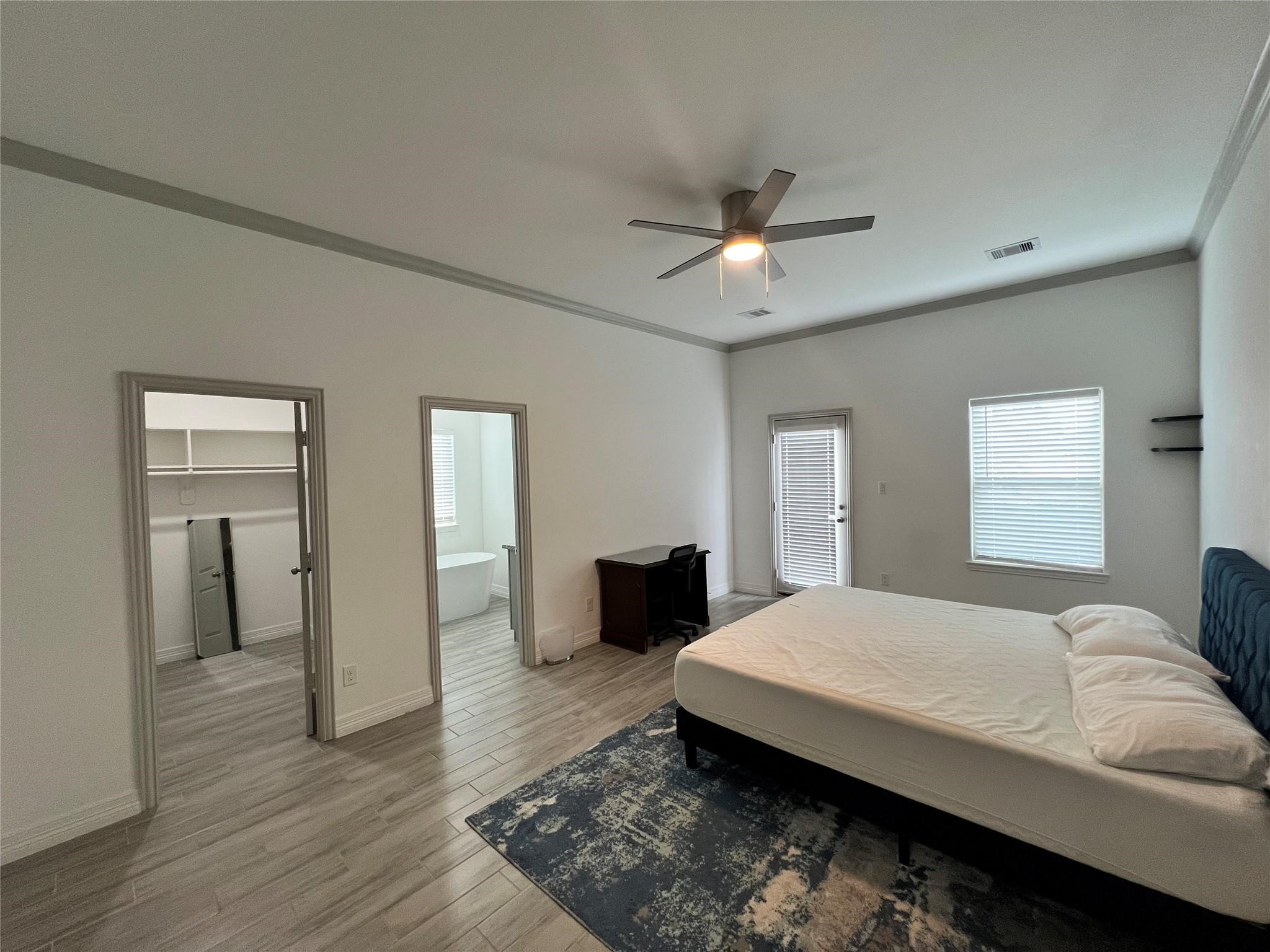 3407 Sakowitz Street, Unit B Houston, TX 77026 - Photo 11 of 23 a bedroom with a bed and wooden floor