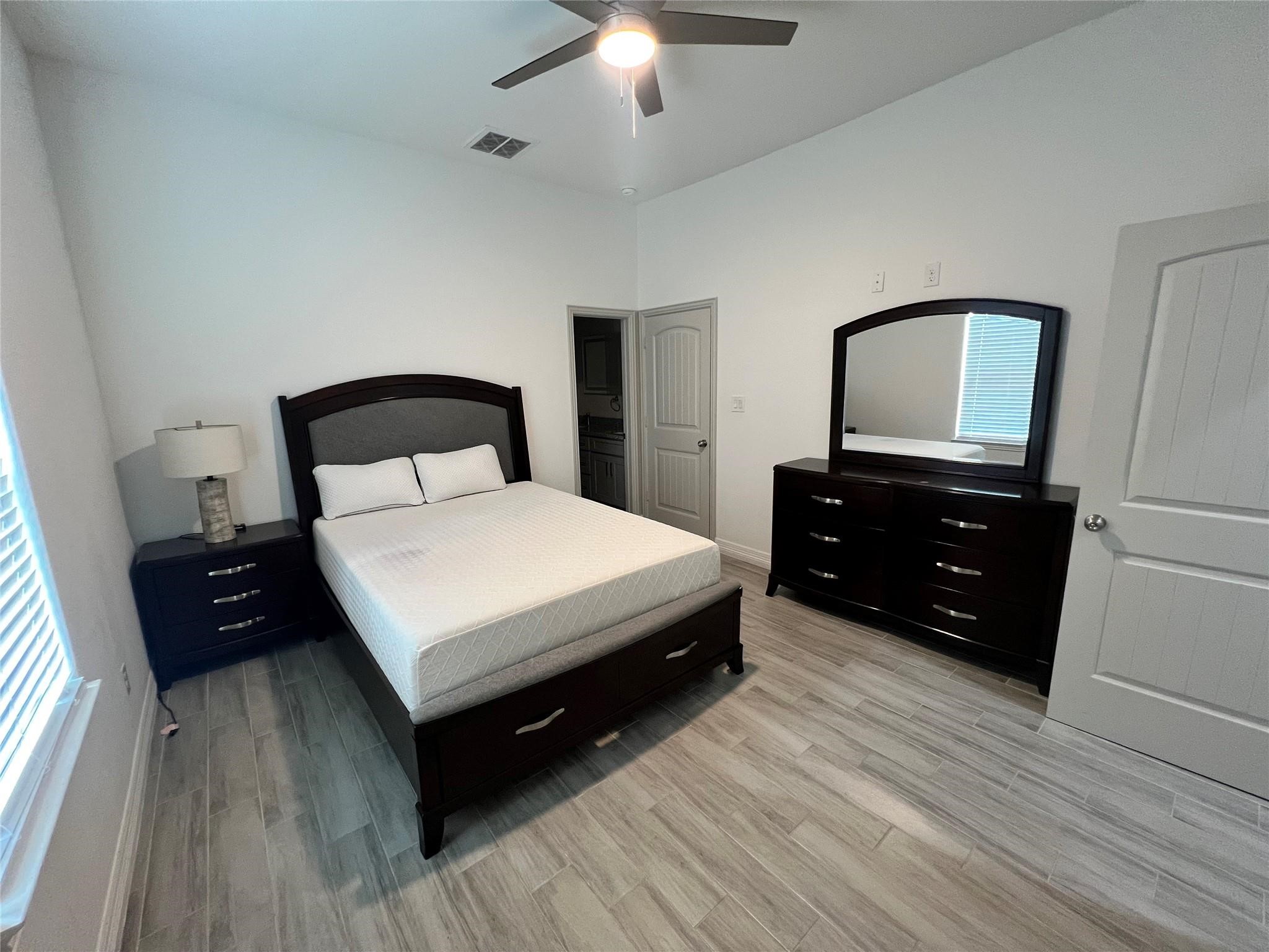 3407 Sakowitz Street, Unit B Houston, TX 77026 - Photo 14 of 23 a bedroom with a bed and a dresser