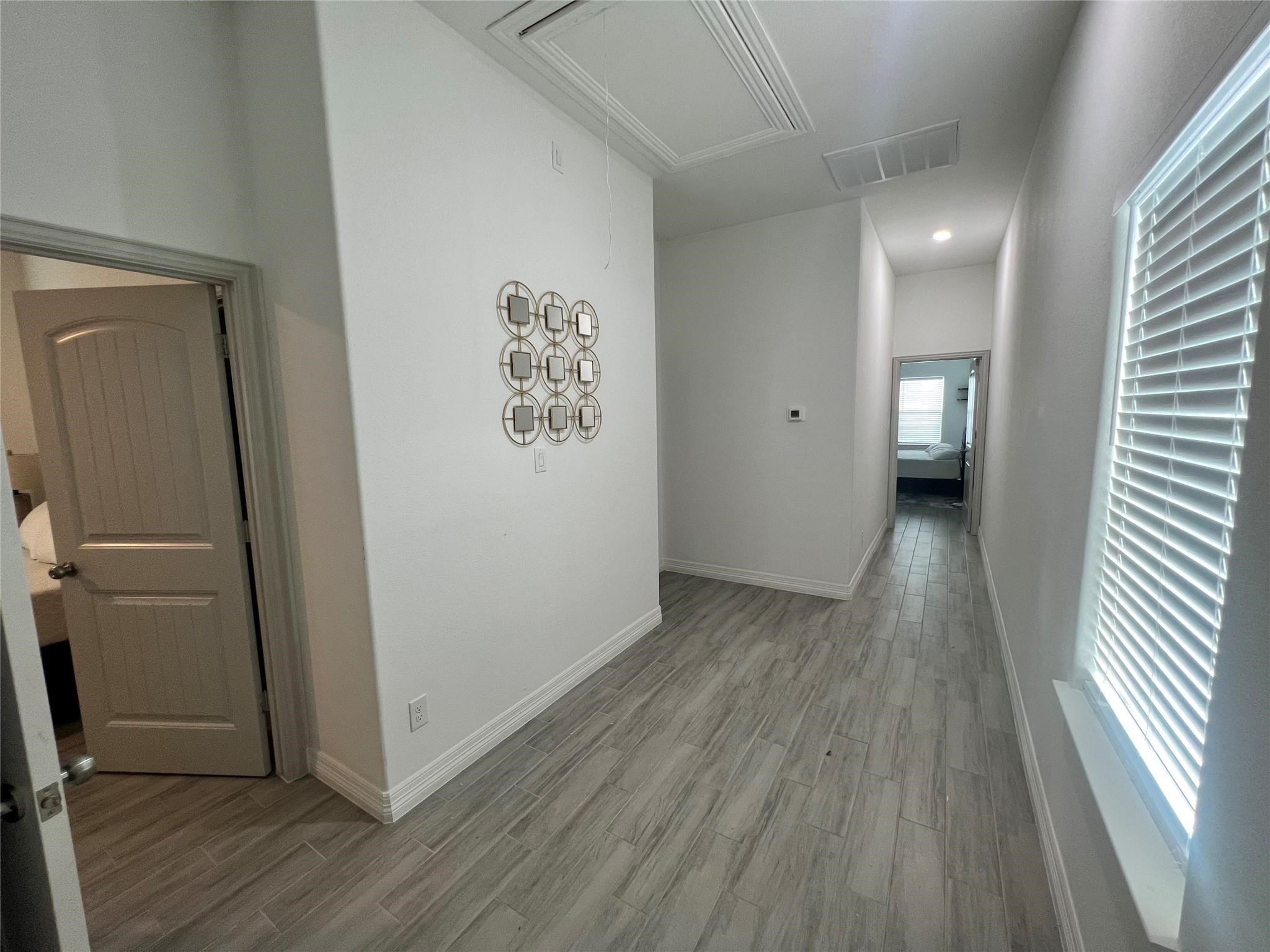 3407 Sakowitz Street, Unit B Houston, TX 77026 - Photo 16 of 23 a view of a hallway with wooden floor