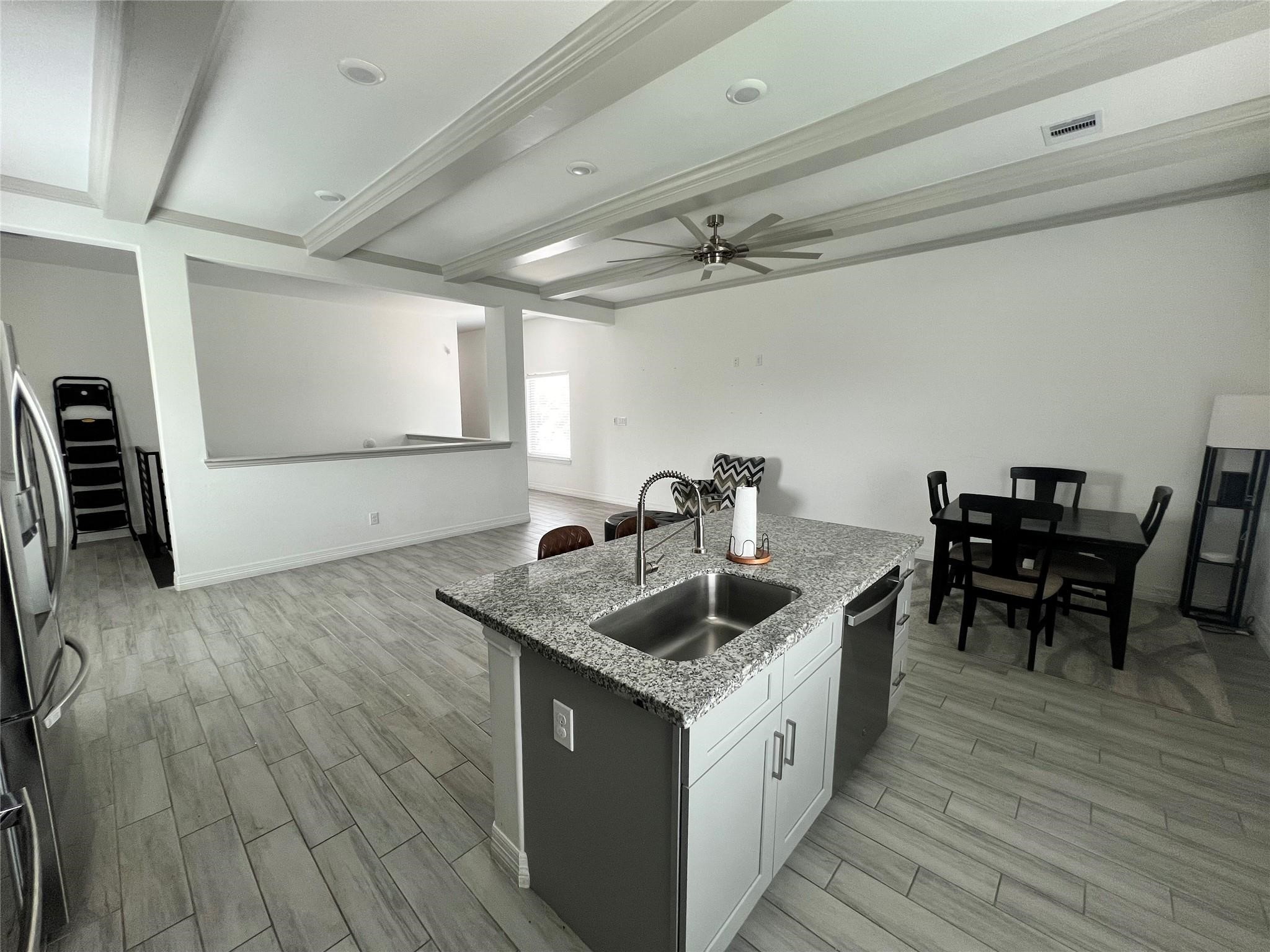 3407 Sakowitz Street, Unit B Houston, TX 77026 - Photo 21 of 23 a kitchen with sink cabinets and wooden floor