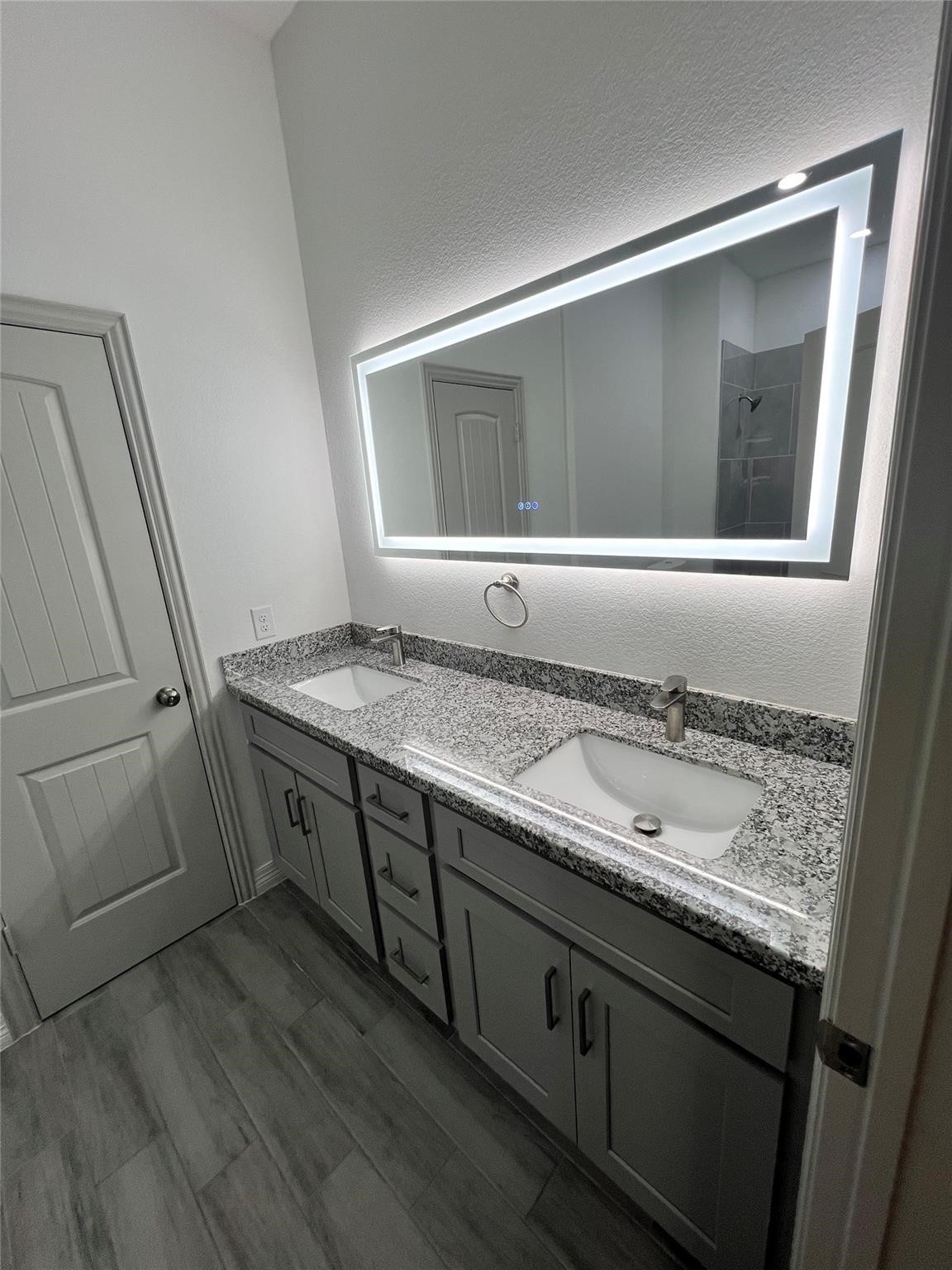 3407 Sakowitz Street, Unit B Houston, TX 77026 - Photo 6 of 23 a bathroom with a granite countertop sink and a mirror