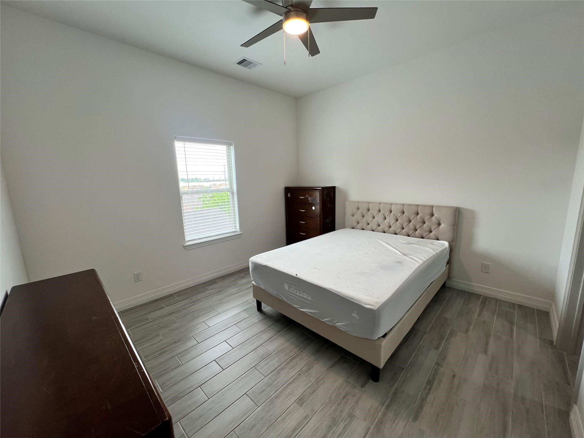 3407 Sakowitz Street, Unit B Houston, TX 77026 - Photo 9 of 23 a bedroom with a bed and window