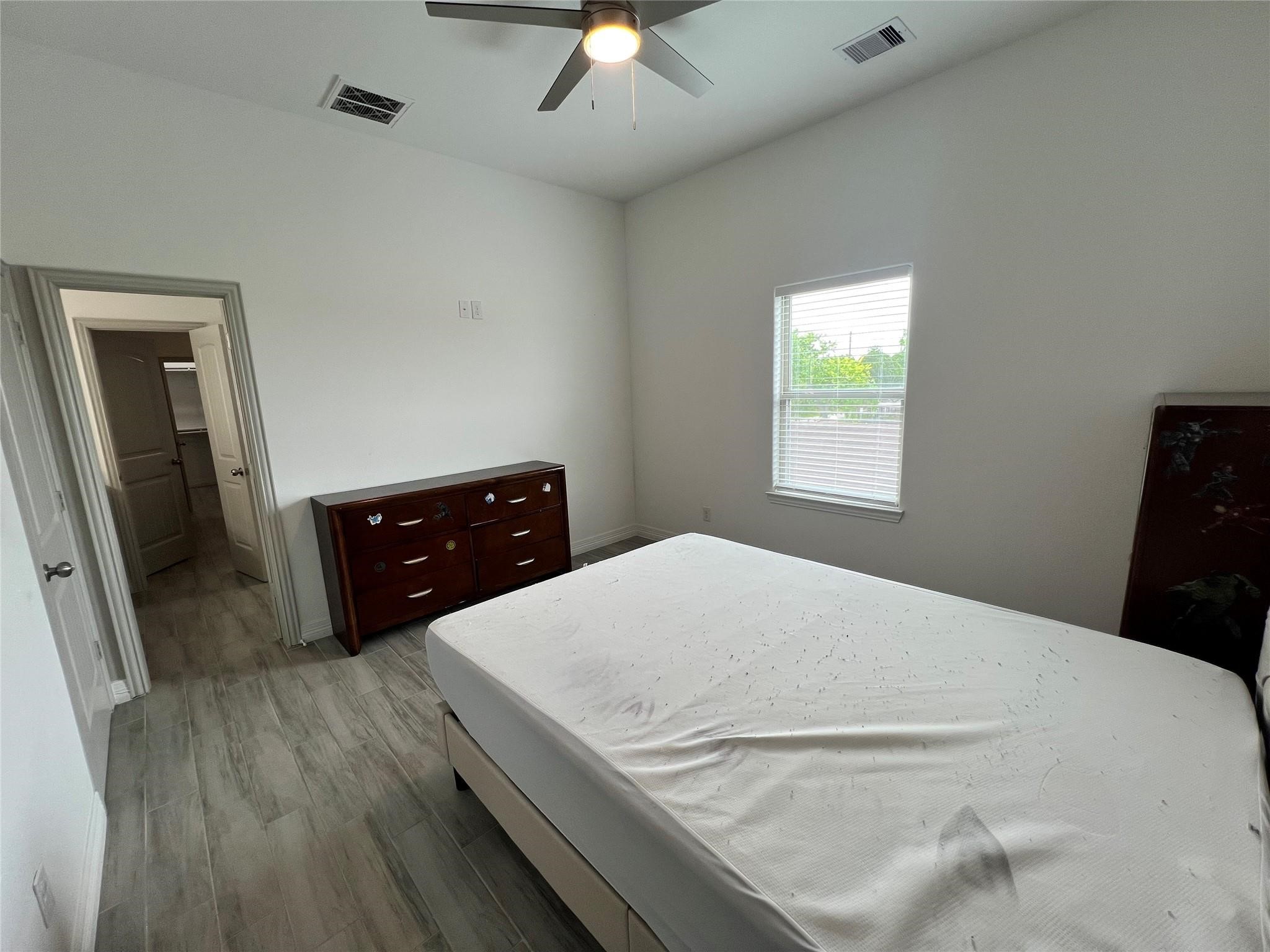 3407 Sakowitz Street, Unit B Houston, TX 77026 - Photo 10 of 23 a bedroom with a bed and a tv