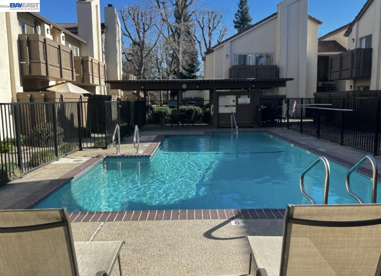 3701 Colonial Drive, Unit 36 Modesto, CA 95356 - Photo 12 of 36 a view of a swimming pool with a patio