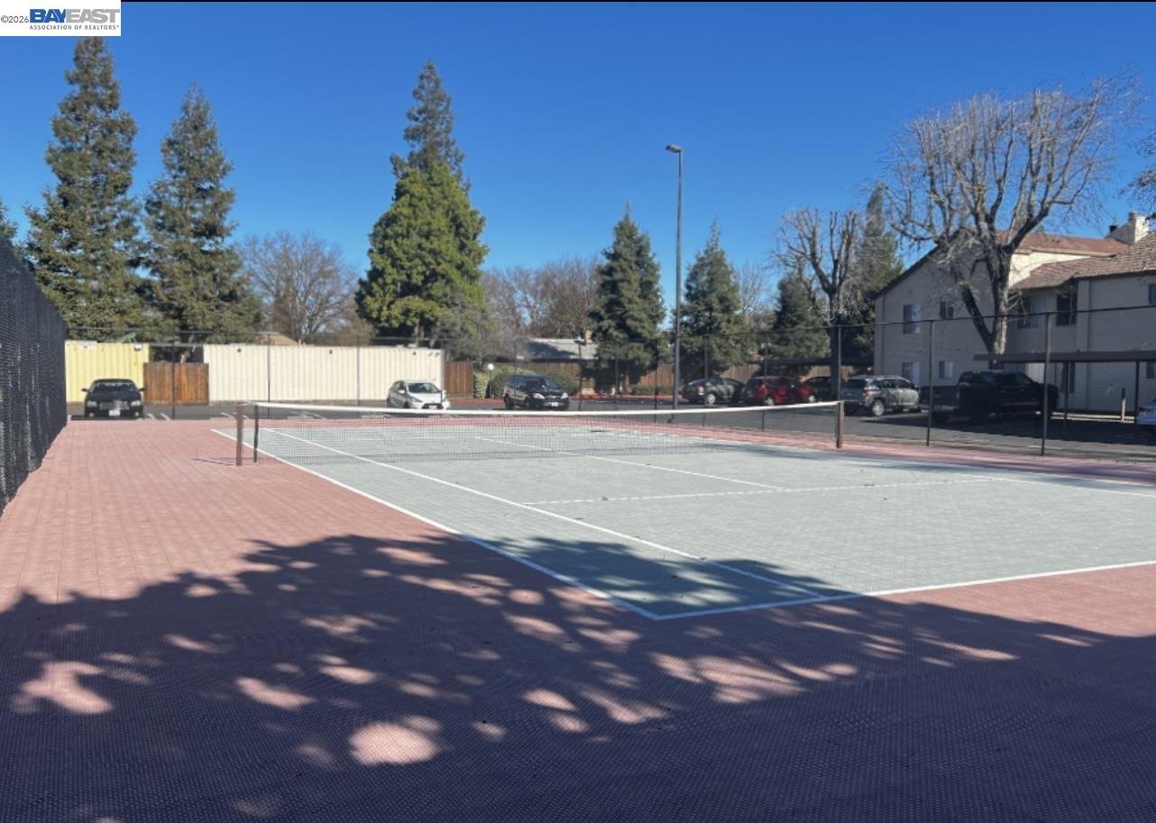 3701 Colonial Drive, Unit 36 Modesto, CA 95356 - Photo 27 of 36 a street view with large trees