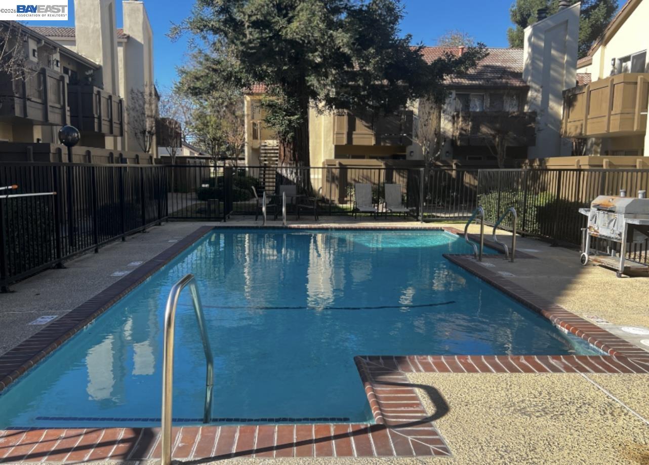 3701 Colonial Drive, Unit 36 Modesto, CA 95356 - Photo 31 of 36 a swimming pool with outdoor seating and yard