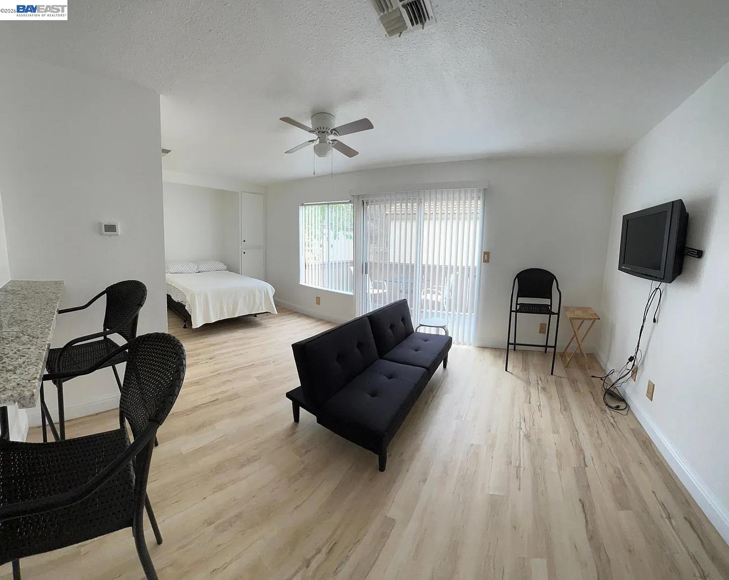 3701 Colonial Drive, Unit 36 Modesto, CA 95356 - Photo 6 of 36 a living room with furniture and a wooden floor